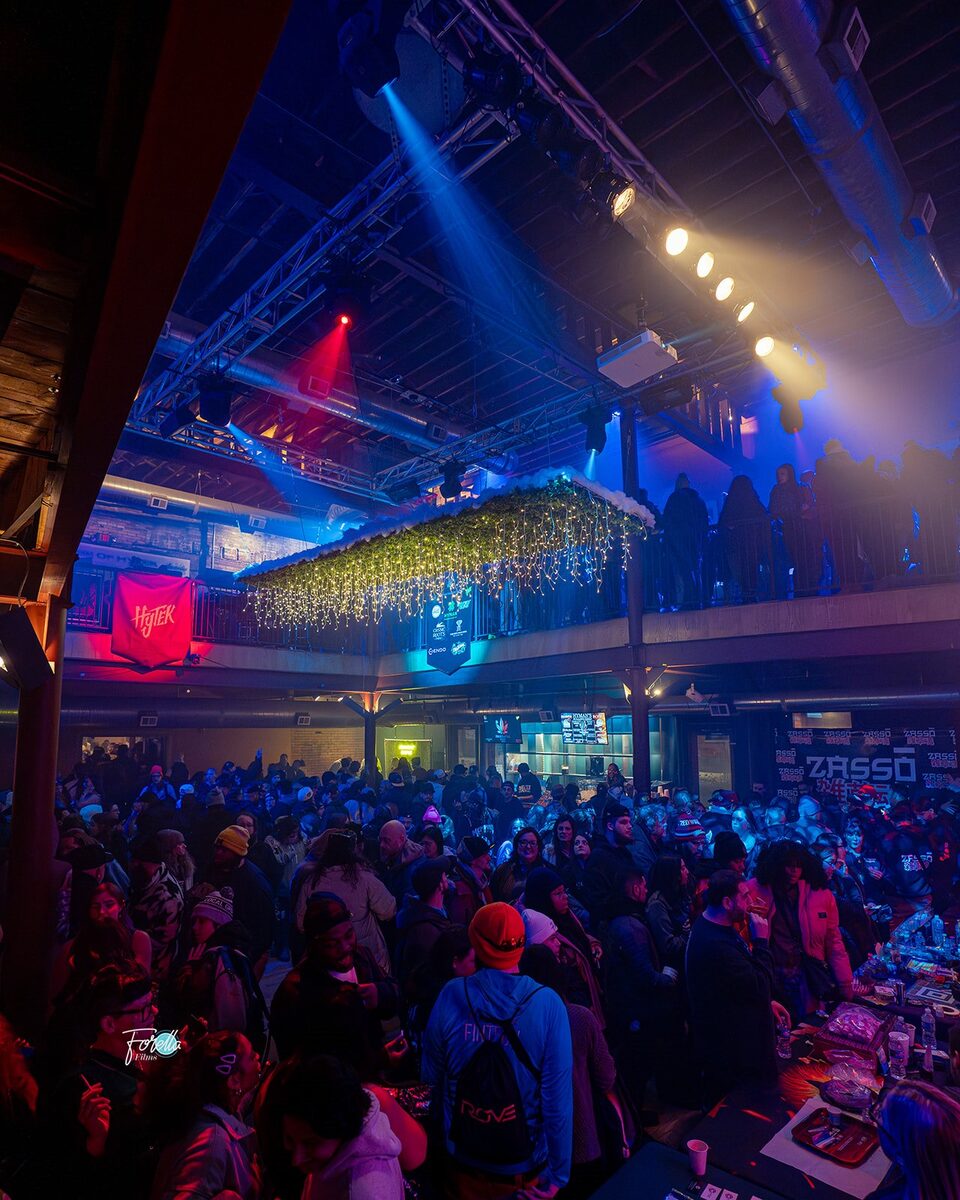 The room from the back, stage lit blue